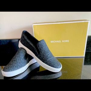 Micheal Kors Keaton Slip-On Signature Logo Sneakers (Black logo). Size 7M.